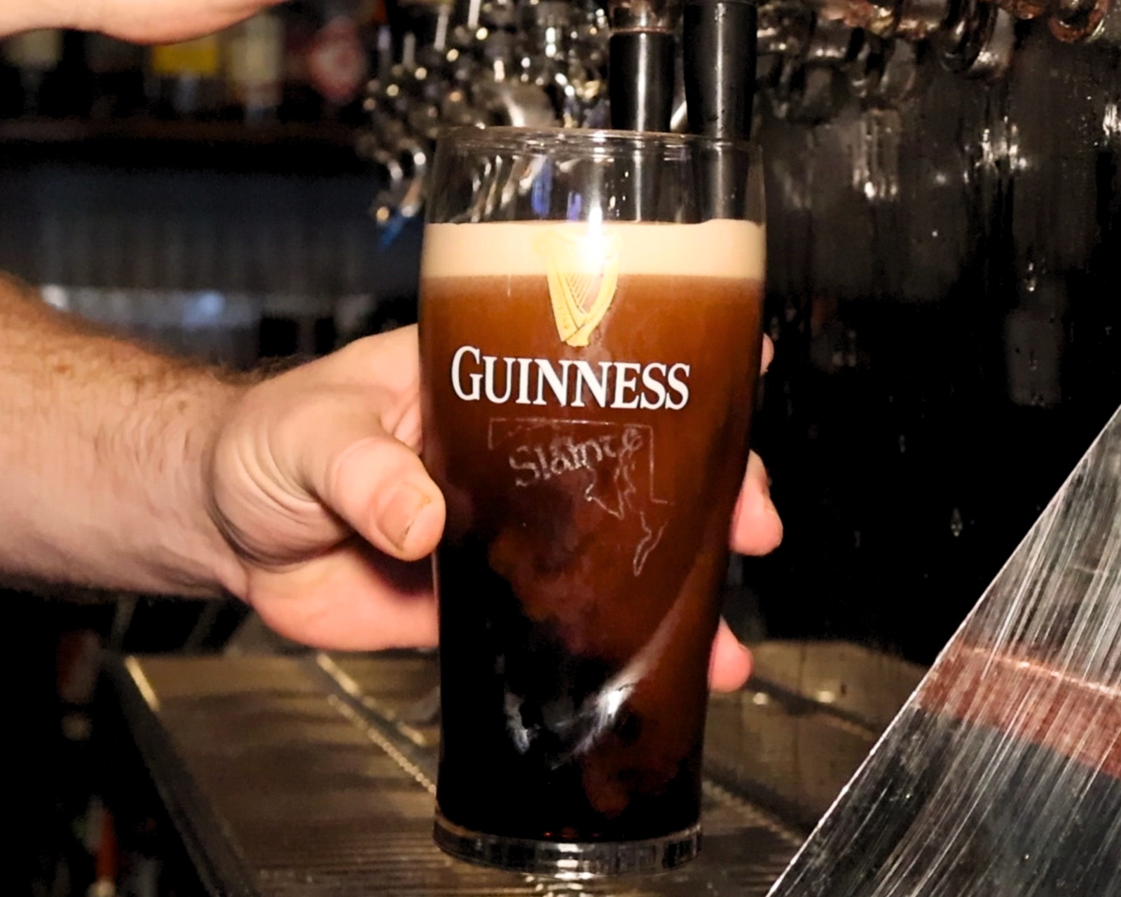 A pint of Guinness poured fresh at Molloy's Irish Pub